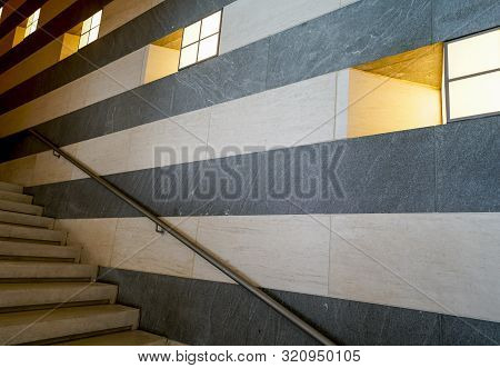 Striking Architectural Design Of Horizontallines, Stairs And Diagonal Hand Rail With Deep Set Window