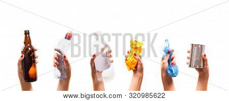 Different Types Of Waste In The Hands On A White Background. Sort Garbage And Environment Concept