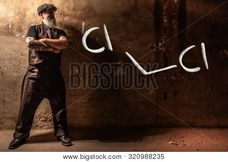 Bearded Old Man Presenting Handdrawn Chemical Formula Of Dichloromethane