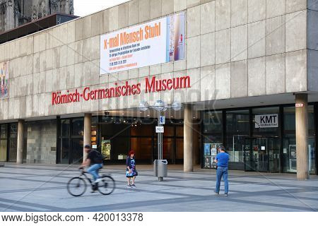 Cologne, Germany - September 21, 2020: People Walk By Romisch-germanisches Museum In Cologne City, G