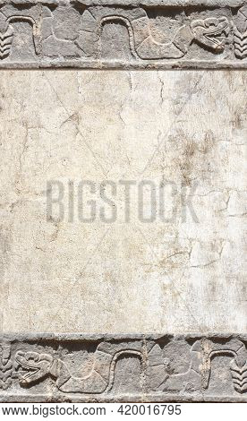 Grunge background with stone wall texture and bas-relief carving of a snake. Vertical banner with copy space for text. Mock up template