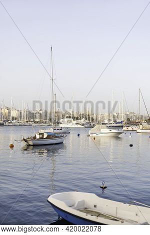 Sailing Yachts Moored At Msida Yacht Marina. Nautical Vessels With Sails At Mediterranean Sea. Water