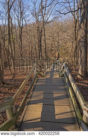 Wooden Stairs Heading Into A Wilderness Canyon In Matthiessen State Park In Illinois