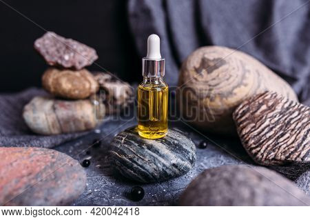 Small Glass Bottle With Natural Magic Oil. Cosmetic And Magic Elixir.