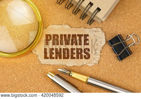 Business And Finance Concept. On The Table Are Office Items And A Cardboard With The Inscription - P