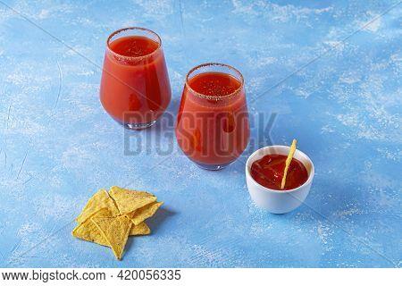 Traditional Mexican Cuisine: Nachos, Corn Tortilla Chips With Spicy Sauce And Alcoholic Drink Michel