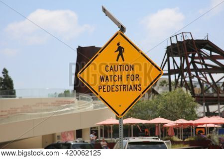 Caution watch for Pedestrians Traffic Sign. 