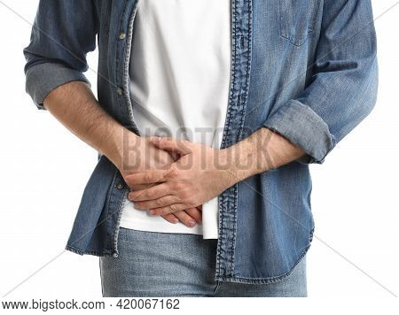 Man Suffering From Acute Appendicitis On White Background, Closeup