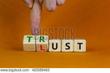 Lust Or Trust Symbol. Businessman Turns Wooden Cubes And Changes The Words 'lust' To 'trust'. Beauti