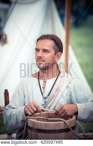 Moscow, Russia - June 23, 2013: Medieval Cooper Making A Barrel During The Great International Yearl