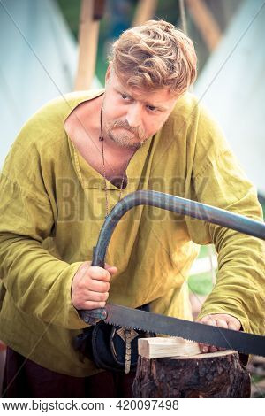 Moscow, Russia - June 23, 2013: Medieval Carpenter In Period Clothes During The Great International 