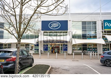 Swansea, Wales, Uk - February 7, 2021: Entrance And Car Park Of Boots Retail Outlet In Morfa Shoppin