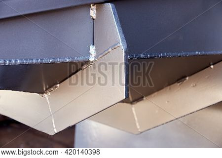 Fragment Of Metal Structure Painted In Silver Color. Stiffeners On The Bottom Of The Loading Hatch