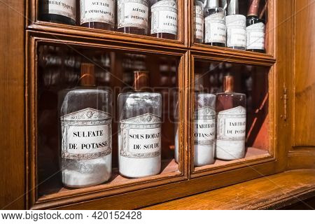 Beaune, France - August 03,2019: Shelf With Medicines In Glass Bottles In A Retro Pharmacy