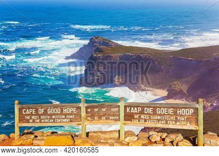 Bird's-eye view. Cape of Good Hope at the southern tip of the Cape Peninsula, South Africa. White foam of the ocean surf. Powerful ocean surf. Bright sunny summer February day.