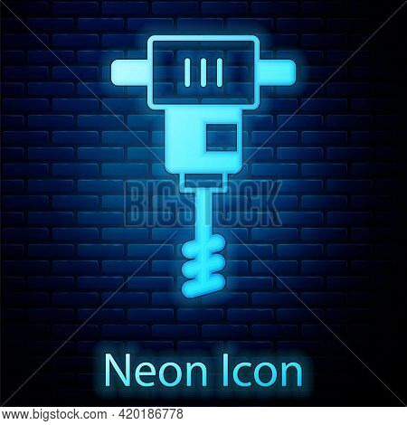 Glowing Neon Electrical Hand Concrete Mixer Icon Isolated On Brick Wall Background. Handheld Electri