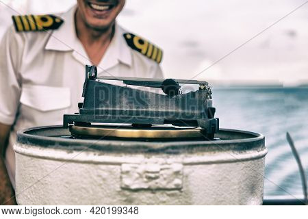 Cruise ship magnetic compass navigational equipment onboard on deck for direction of heading of the vessel, the ship's head.