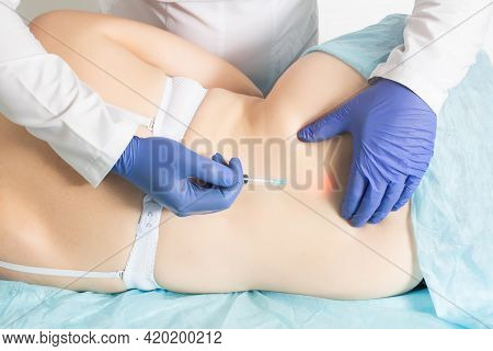 The Doctor Gives A Medical Injection With Pain Medication And Chondroprotective Agent To Restore The