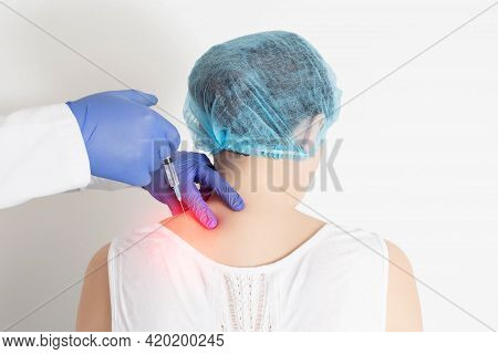 The Doctor Makes An Injection Medical Blockade Into The Paravertebral Tissue To Relieve Pain And Pin