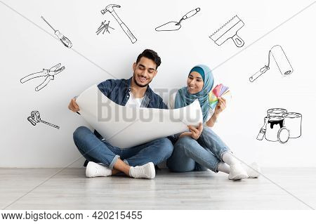 Creative Muslim Couple Working On Design For New House