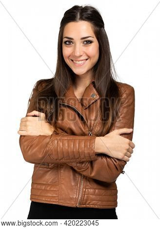 Neautiful young woman wearing a leather jacket isolated on white