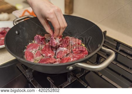 Cooking Pilaf In A Cauldron. A Step By Step Recipe For Cooking Pilaf, Cut The Beef Into Pieces And F