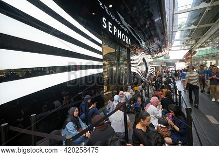 KUALA LUMPUR, MALAYSIA - JANUARY 18, 2020: people sit in line waiting for the grand opening of Sephora store at Fahrenheit 88 shopping mall in Kuala Lumpur.