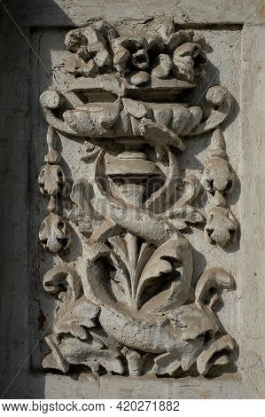 The Classical Facade Of The Old House. Ancient Plaster. The Castle Building Is Decorated With Carved