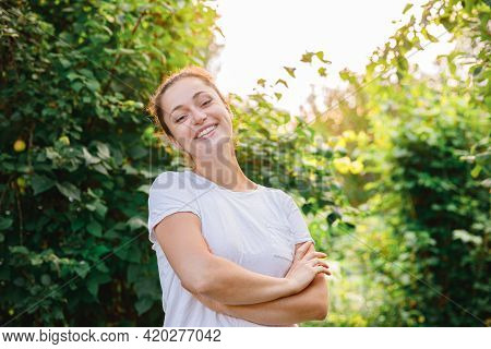 Young Woman Smiling Outdoor. Beautiful Brunete Girl Resting On Park Or Garden Green Background. Free