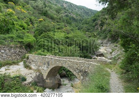 Stone Bridge Over The Rio Barbaira Along The Valle Nervia, Rocchetta Nervina, Liguria - Italy