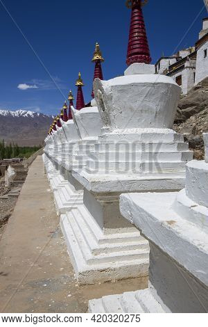 White Buddhist Stupa Or Pagoda In Tibetan Monastery Near Village Leh In Ladakh Region, Noth India