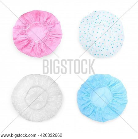 Set With Waterproof Shower Caps On White Background, Top View