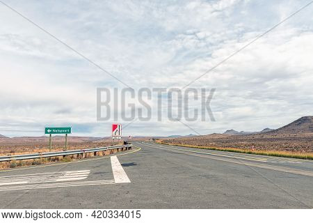 Turn-off From National Road N1 To Nelspoort In The Western Cape Karoo. Vehicles And Road Signs Are V
