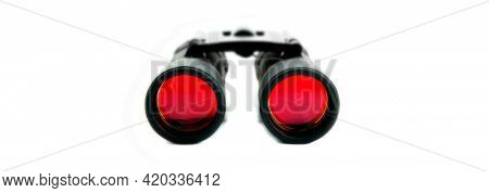 Closeup of isolated binoculars with red lenses for viewing sports widlife and birds