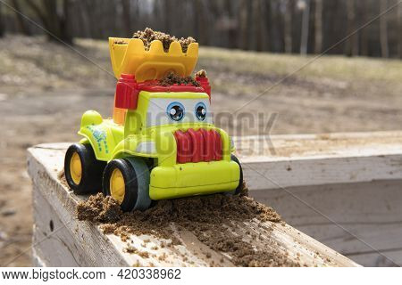 Children's Toy Car In The Sandbox. Sandbox.