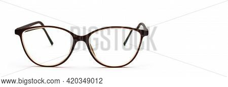 Modern Glasses Stay On White Background. Vision Concept. Way To Improve Eyesight. Isolated. High Qua