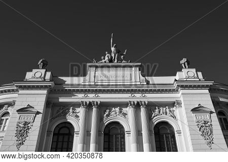 Facade Top Of The Main Building Of Warsaw University Of Technology In Black And White