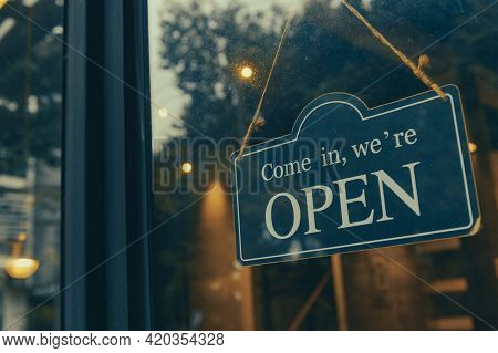 Come In, We Are Open - Open Sign Broad Hang On Entrance Door With Copy Space At Coffee Shop Or Resta