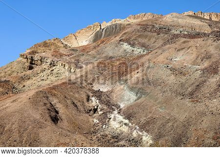 Eroded Hillside Covered With Sandstone And Sedimentary Rocks Rich With Minerals Taken On Arid Badlan
