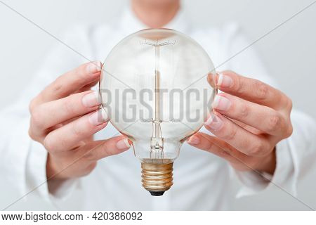 Lady Holding Lamp With Formal Outfit Presenting New Ideas For Project, Business Woman Showing Bulb W