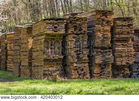 Lots Of Stacked Wooden Boards On A Lumber Yard In Sunny Ambiance