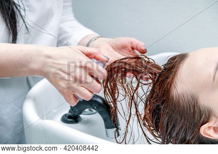 Stylist Washes The Girls Head. High Quality Photo