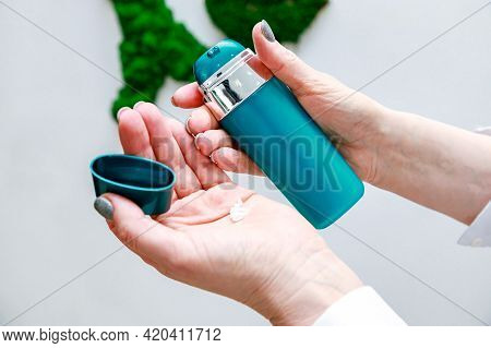 Tube With Cream Opened And Squeezed In Hands