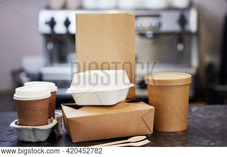 Sustainable Recyclable Takeaway Food Packaging On Counter In Coffee Shop