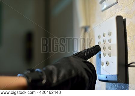 Mans Hand Dials The Code From The Security System At Home On A Keypad With Numbers From Theft And Bu