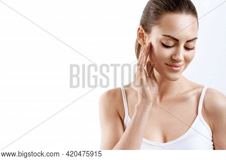 Beauty Face. Woman With Natural Makeup And Healthy Skin Portrait. Beautiful Girl Model Touching Fres