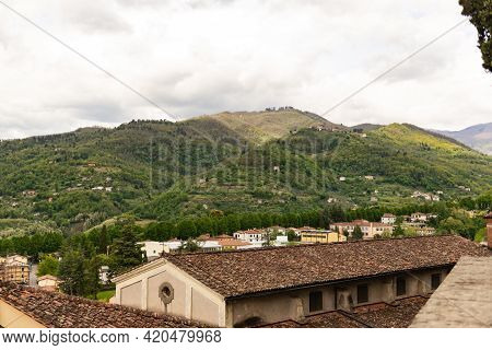 Old Tiled Roof. Beautiful Roofs In The Medieval Town Of Barga In Tuscany In The Mountains Of Italy. 