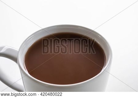 Chocolate Milk Close Up In White Cup On White Background. Coco Hot Drink In The Morning For Health. 