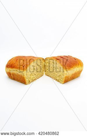 Delicious Homemade Spiced Bread Cut In Half Isolated On White Background. Verticla Shot.