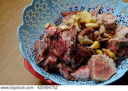A Picture Of Raw Meat Been Mix With Onion And Ginger To Remove It Smell Before Making 